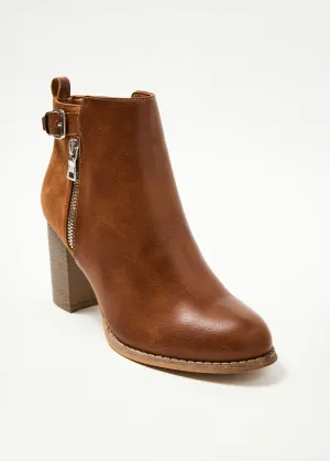 High heeled bi-material boots with buckle and zip